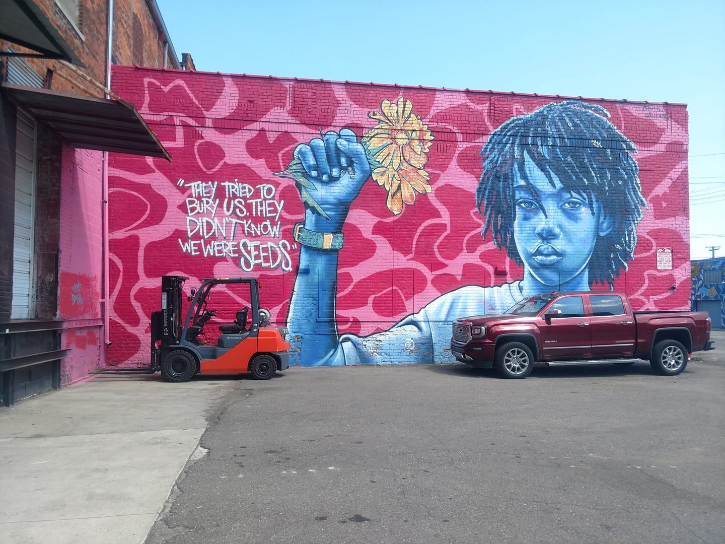 Graphite of a image that says they tried to bury us they didn't know we were seeds.